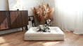 Load image into Gallery viewer, The Chelsea dog bed in Ivory boucle, photographed in a living room (Ivory Boucle)