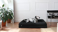 Load image into Gallery viewer, A dog resting on The Chelsea dog bed in Onyx boucle (Onyx Boucle)
