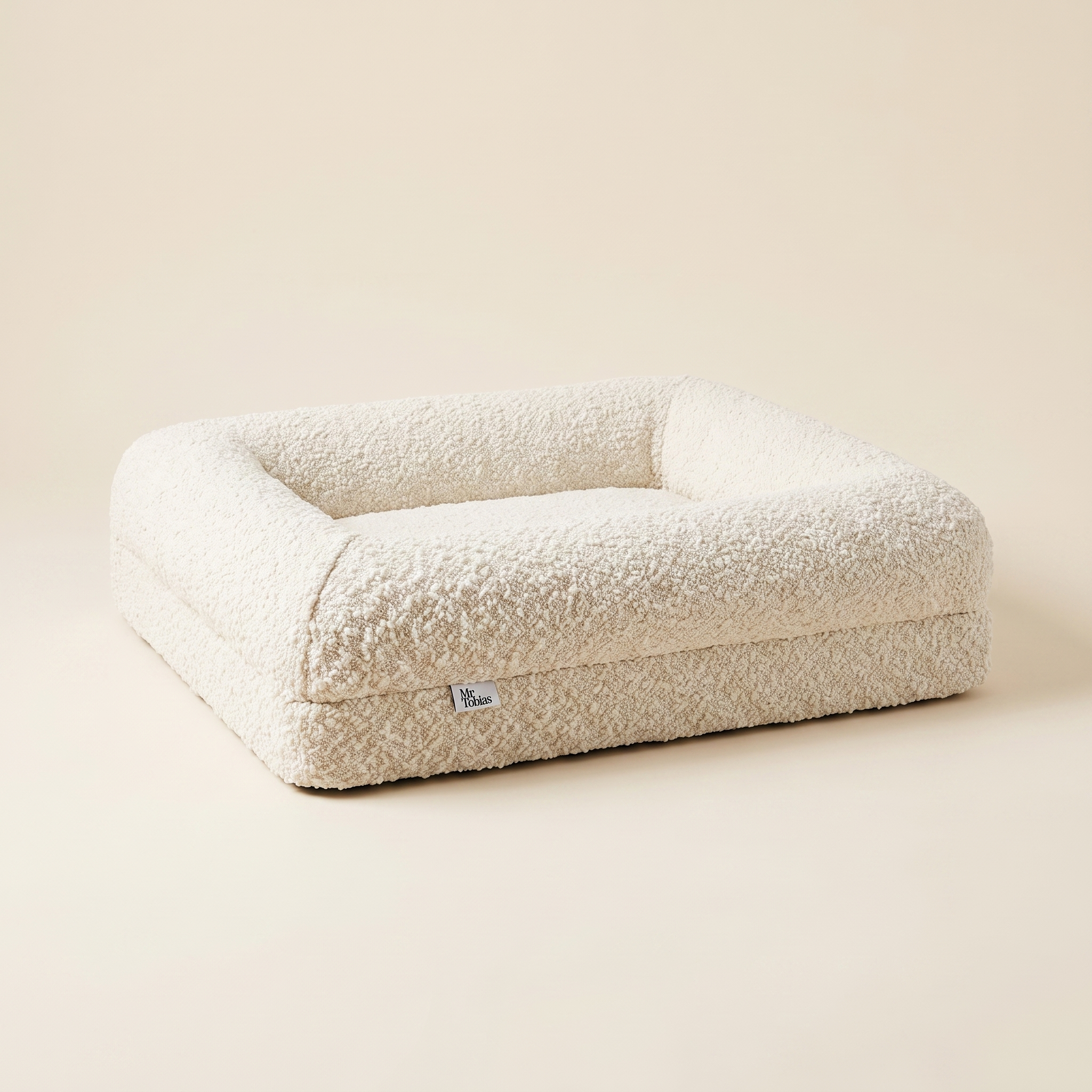The Chelsea dog bed styled in a light, minimal home interior