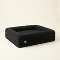Load image into Gallery viewer, The Chelsea dog bed shown at floor level, calm and low-profile
